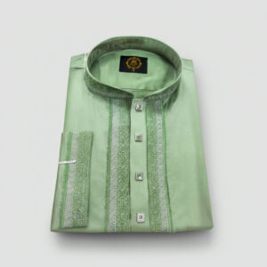 A neatly folded light green men's kurta with intricate green and silver embroidery on the placket and band collar, featuring stylish square silver buttons.